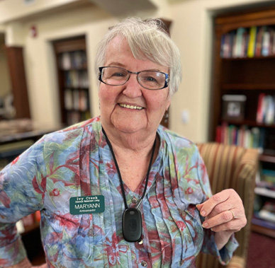 Senior lady color shirt with Lively call device