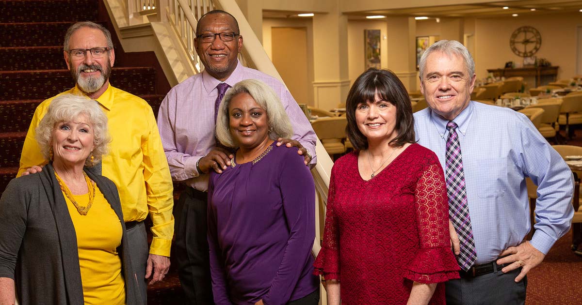 Riverwalk Estates staff members on stairs